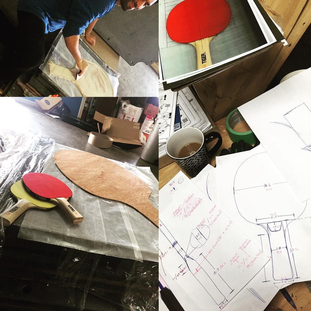 Early Tiger paddle prototypes beside hand-drawn dimensions and design notes.