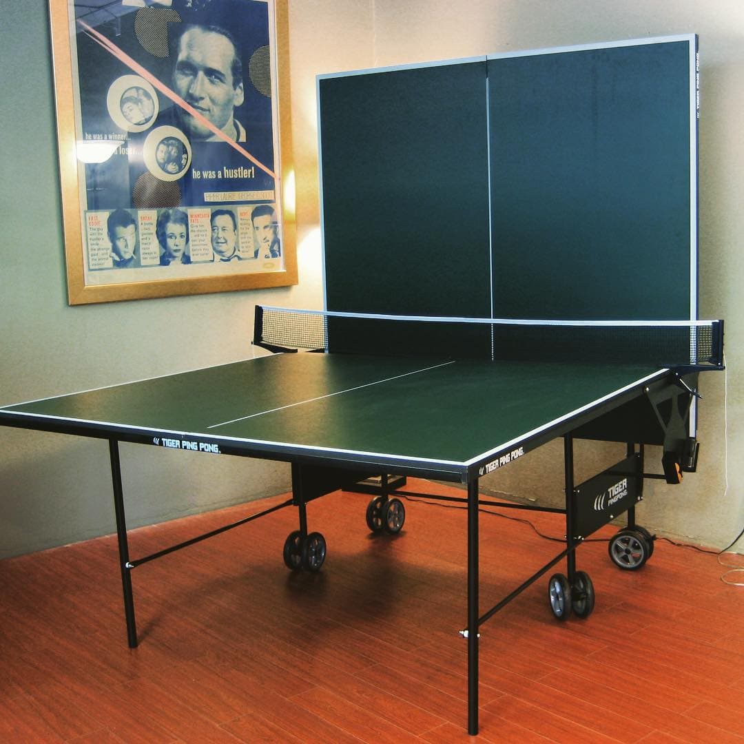 Tiger's first pre-Expo PingPong table with a green top and skinny legs.