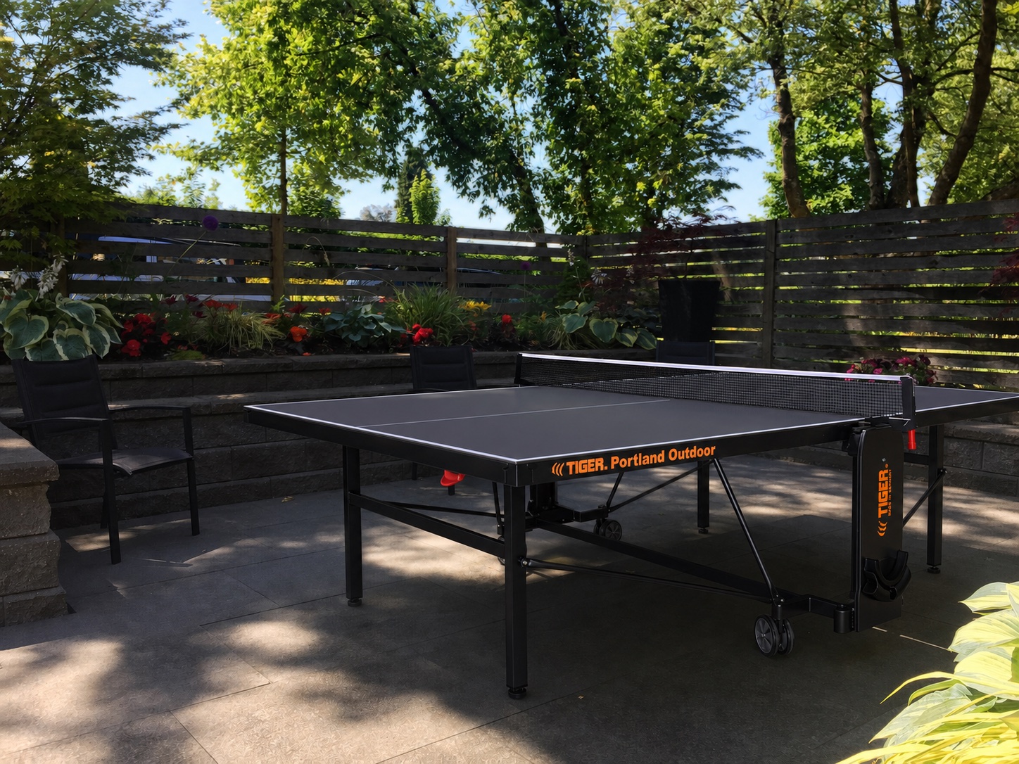 Grey Portland Outdoor V2 PingPong table on a shaded backyard patio